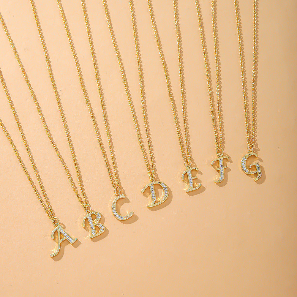 The K.Bola Fashion English 26 Letters Inlaid Zircon Copper Necklace collection features elegant women’s necklaces with gold pendants displaying letters A to G on O-shaped chains, beautifully arranged on a warm beige background.